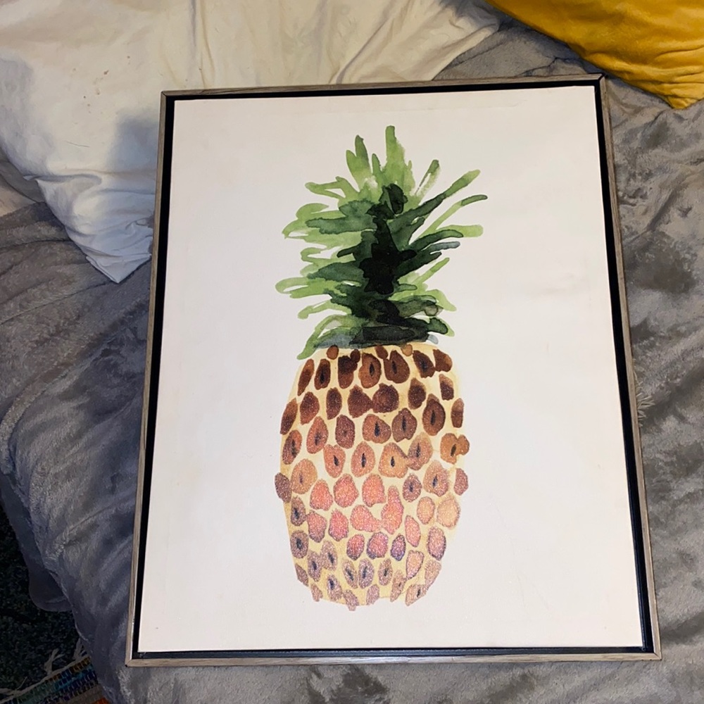 Pineapple print in wood frame.